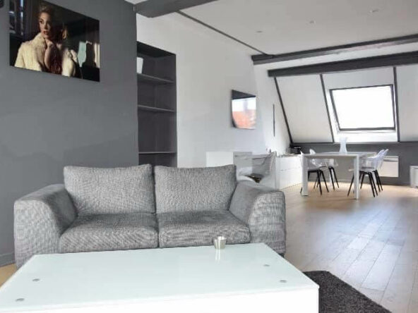 Image du salon d'un Appartement à vendre Vieux Lille par agence immobilière Lille